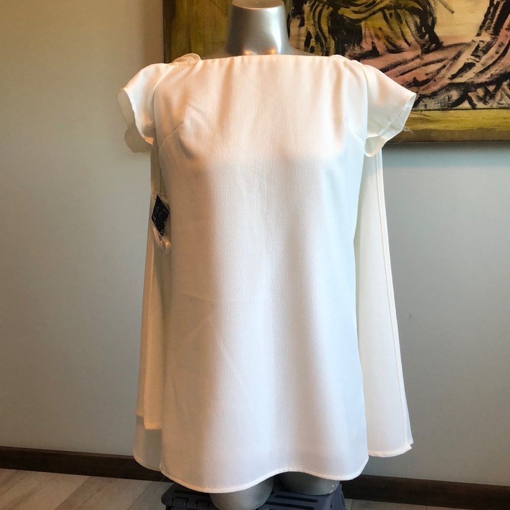 White mini dress with cape and capped sleeves. Size small nasty gal